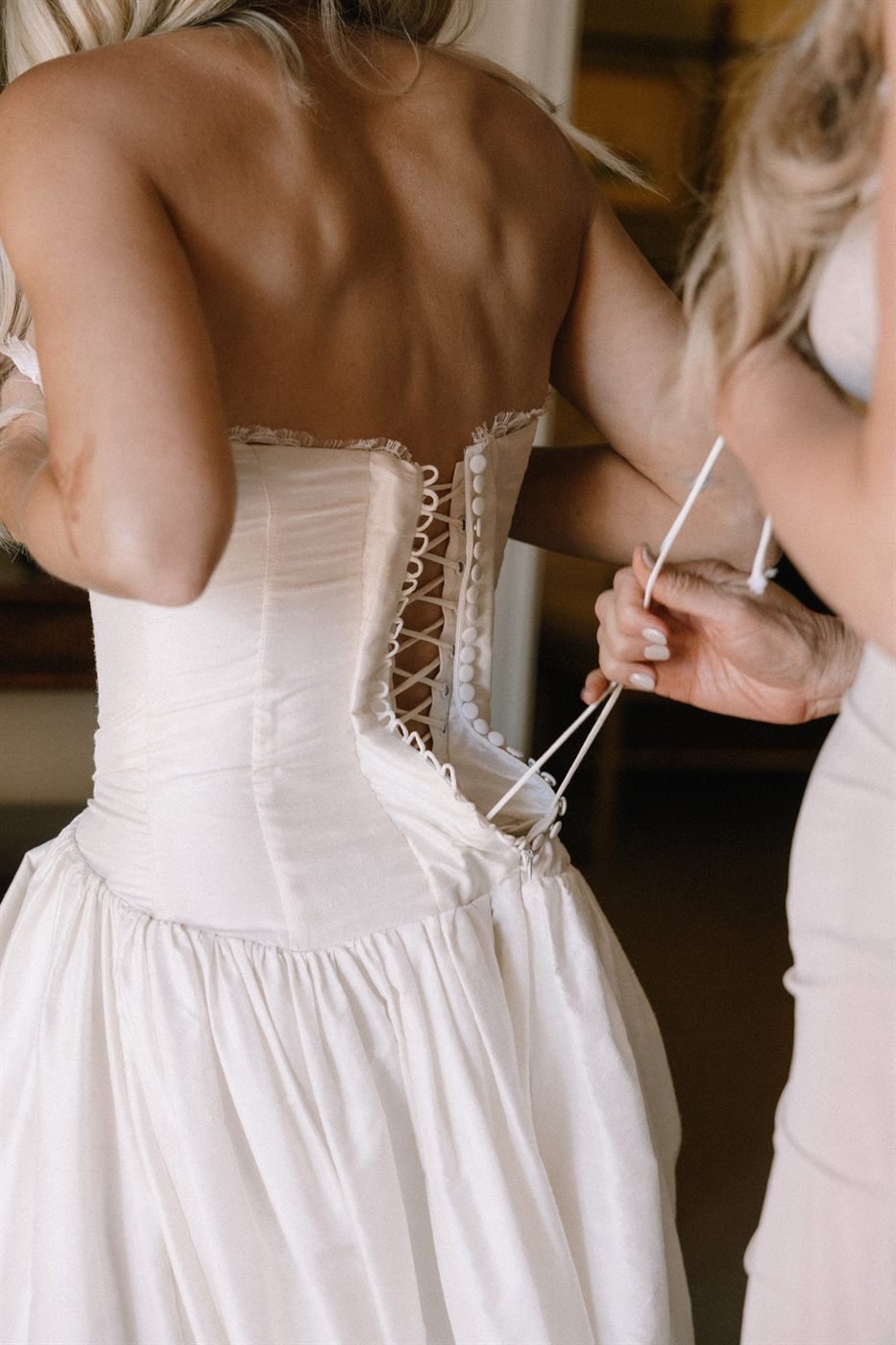 The hidden corset laced through the back of the Montecito gown&rsquo;s bodice, pulled tight by hand.